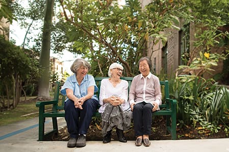 Residents enjoying time together in a garden