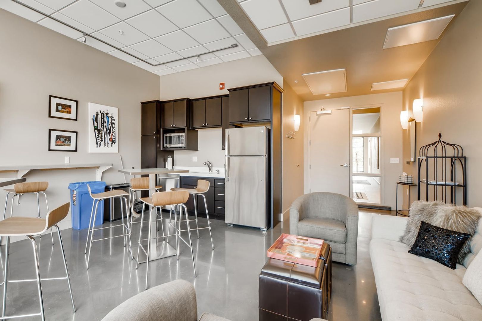 Bright common area with seating and kitchen space