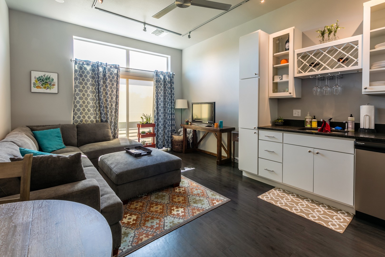Cozy interior of a private resident room with a sofa and kitchenette