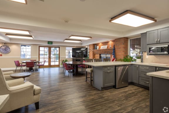 Bright common area with seating and dining tables