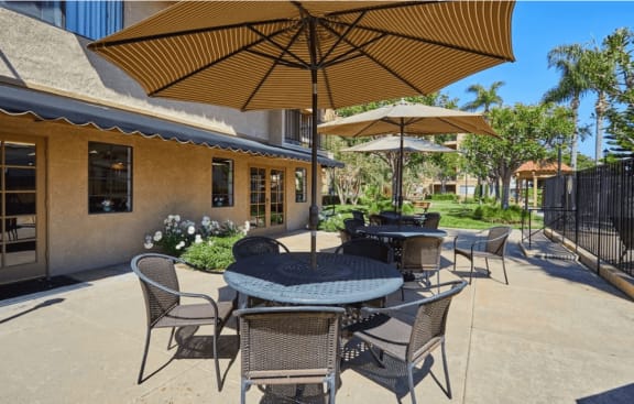 Outdoor patio with tables and umbrellas