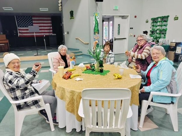 Residents enjoying a gathering around a table