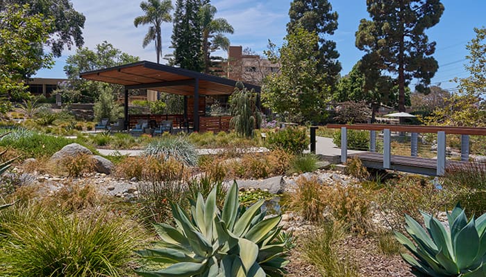 A serene garden area with a gazebo and walking paths
