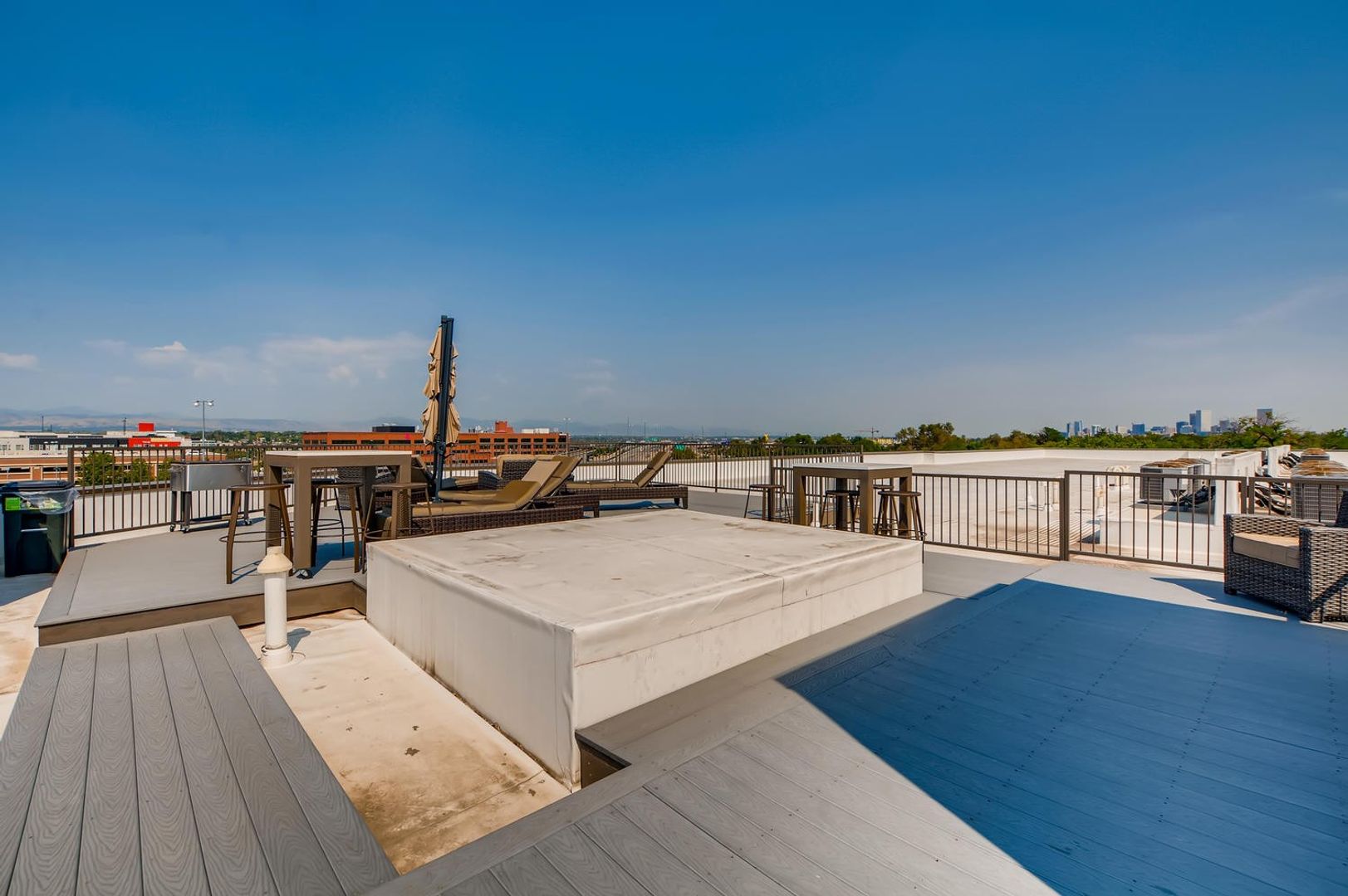 Outdoor rooftop lounge area with seating