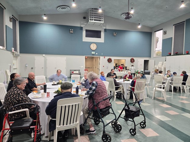 Residents enjoying a meal in a dining area