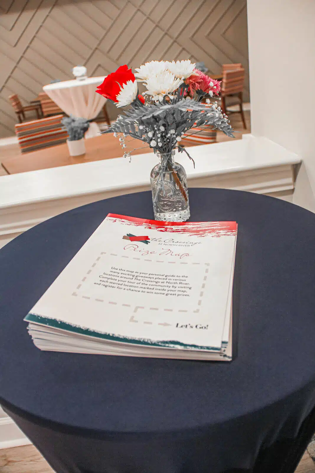 Decorative table setting with flowers and event sign