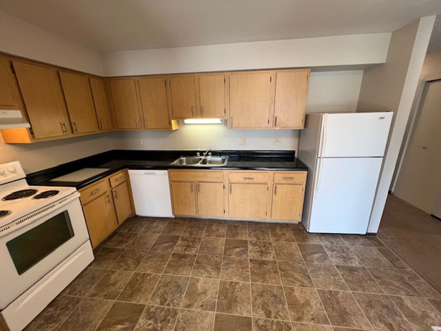 Kitchen area with cabinets and appliances
