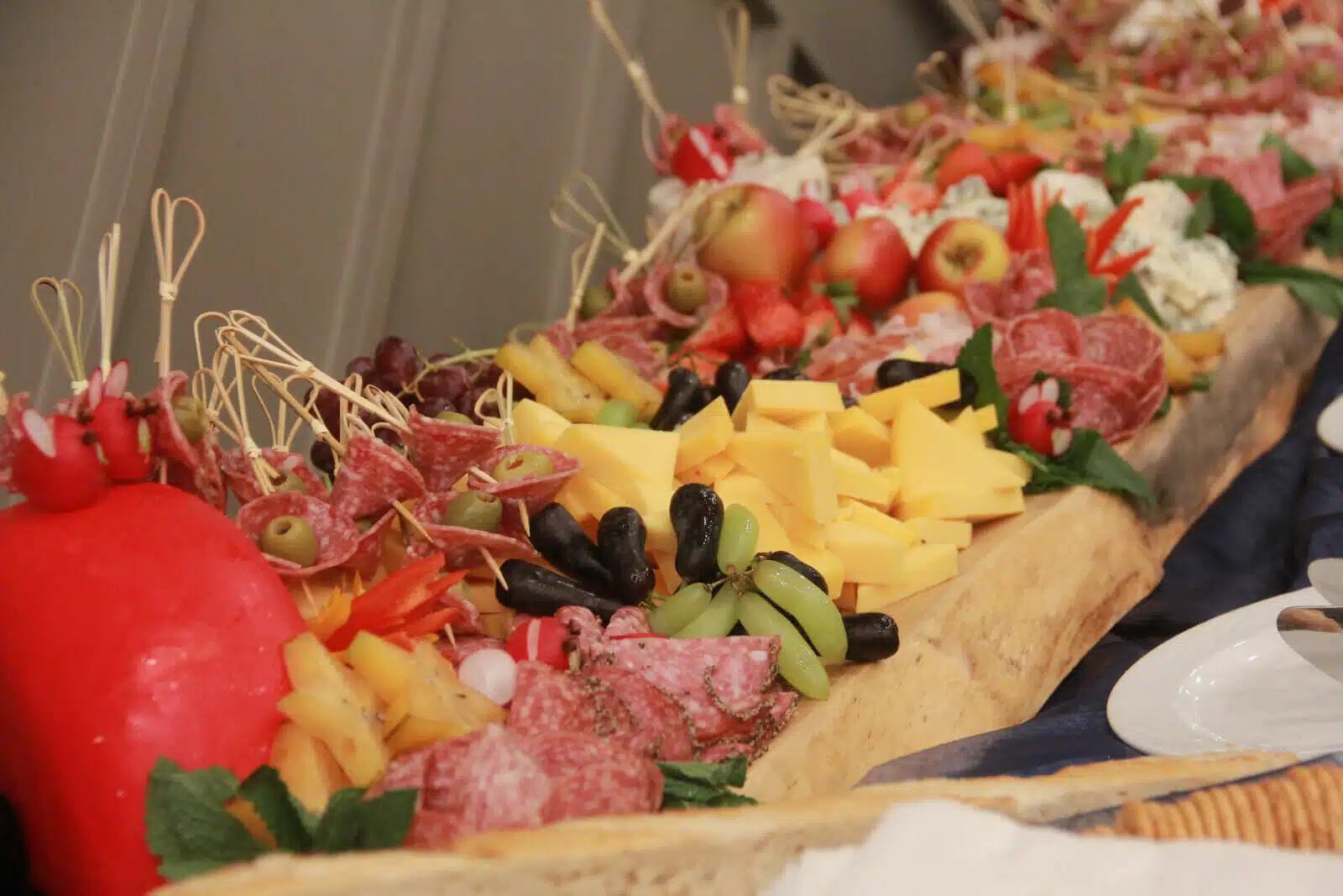 A beautifully arranged platter of assorted meats and cheeses