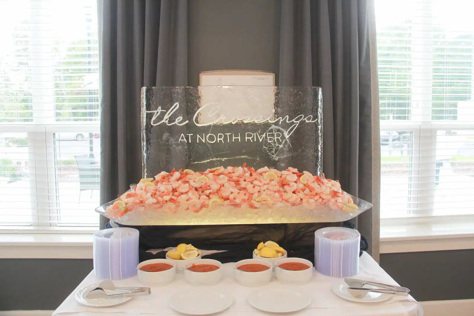 Ice sculpture featuring seafood at a dining event