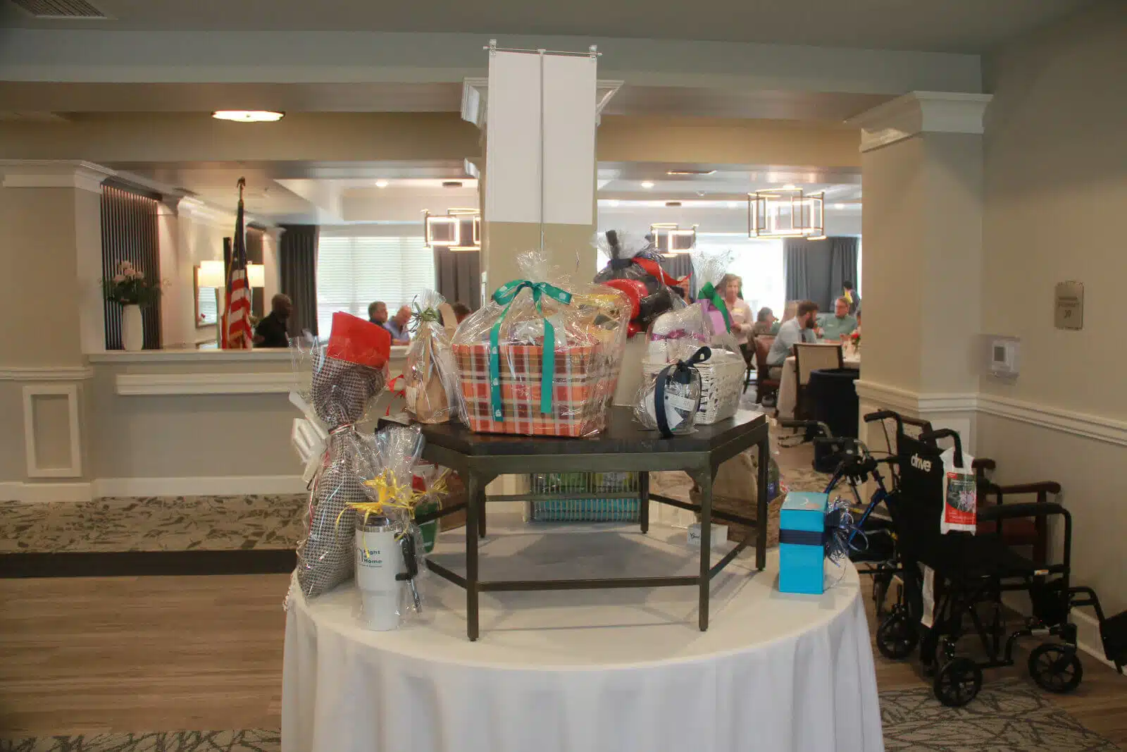 Residents participating in a raffle event with displayed baskets
