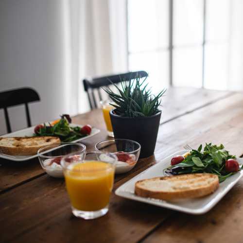 Table setting with meals and drinks in a dining area