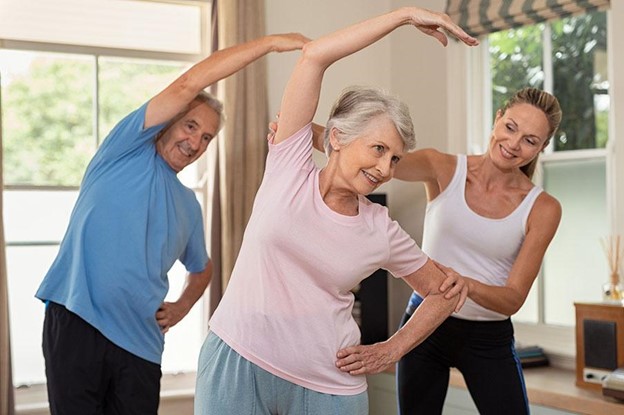 Residents participating in a group exercise class indoors