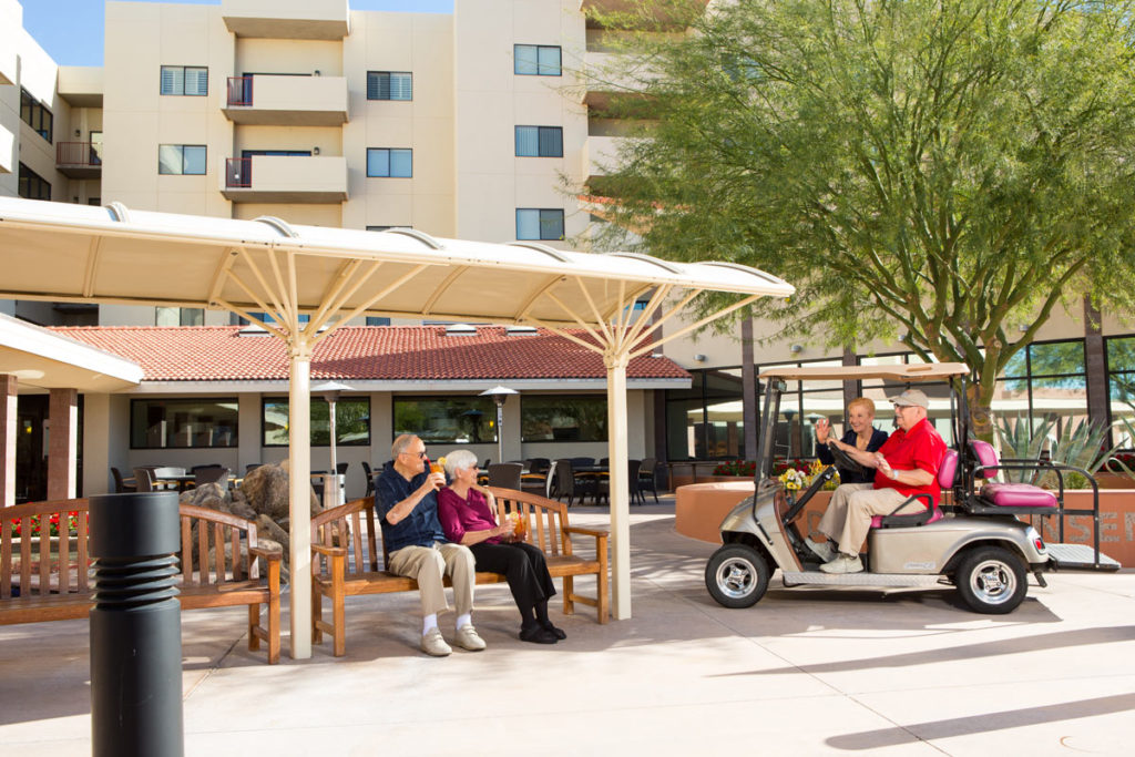 Residents enjoying outdoor time near the facility