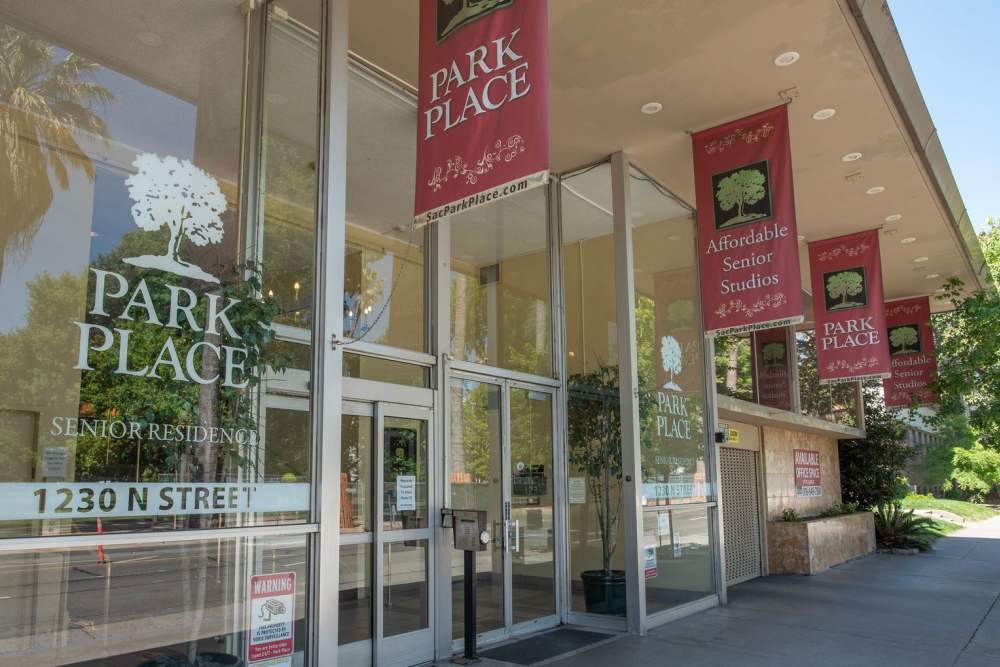 Exterior view of Park Place Apartments with signage