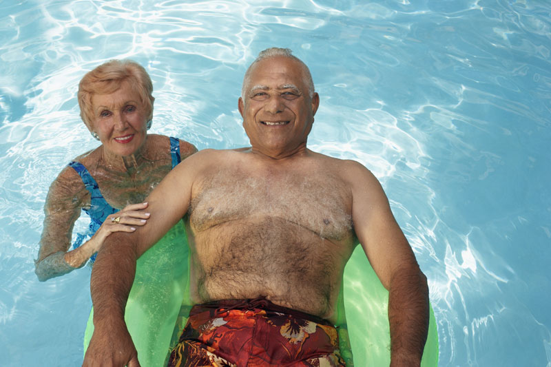Residents enjoying a swim together in a pool