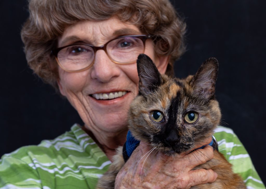 Resident happily holding a cat