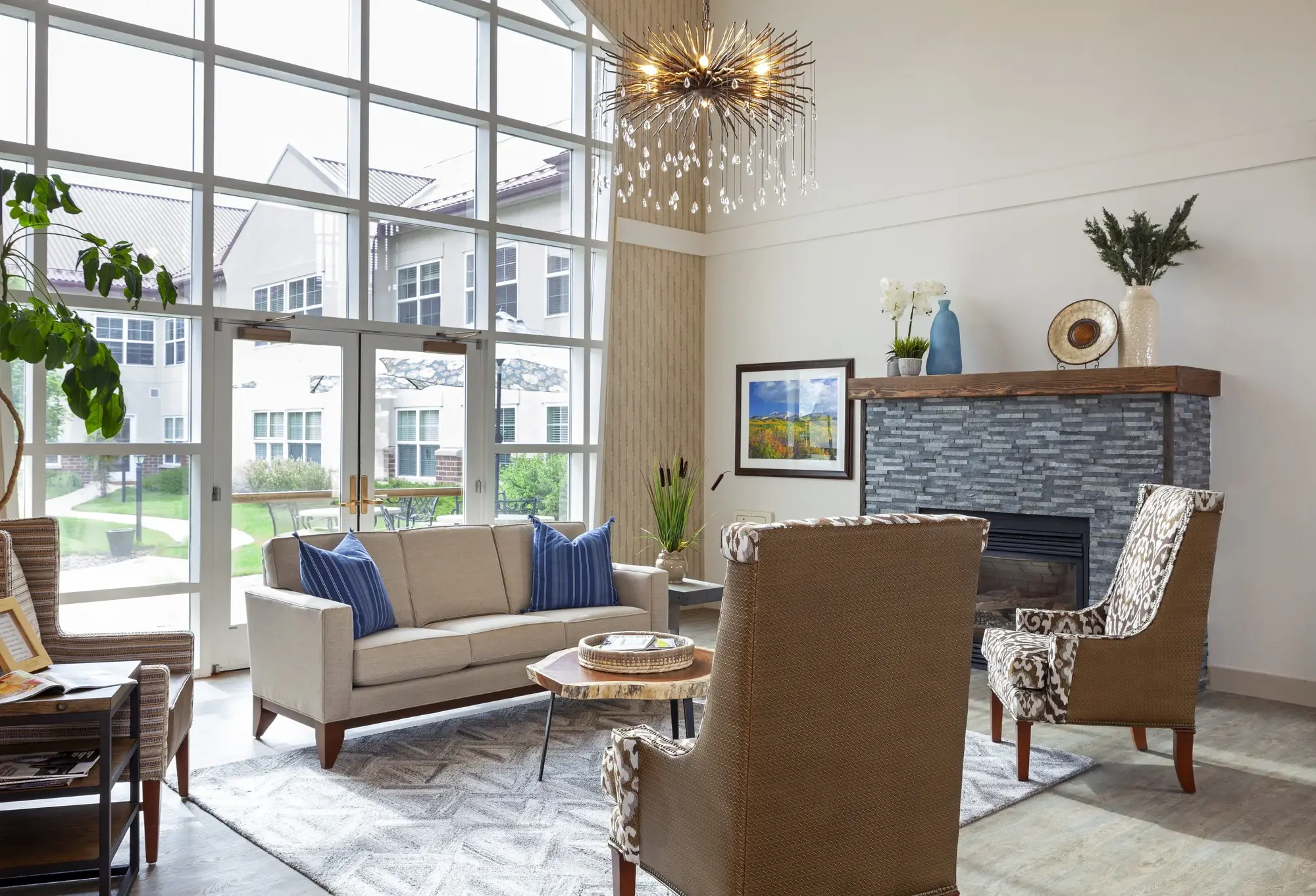Bright common area with seating and large windows