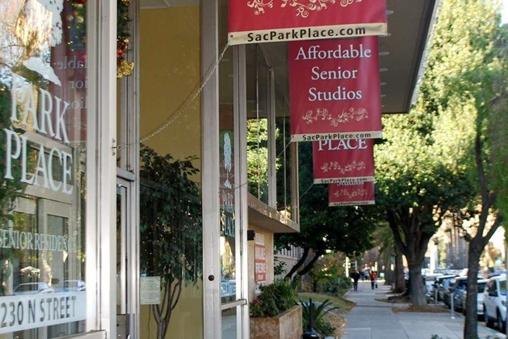 Entrance to Park Place Apartments with signage
