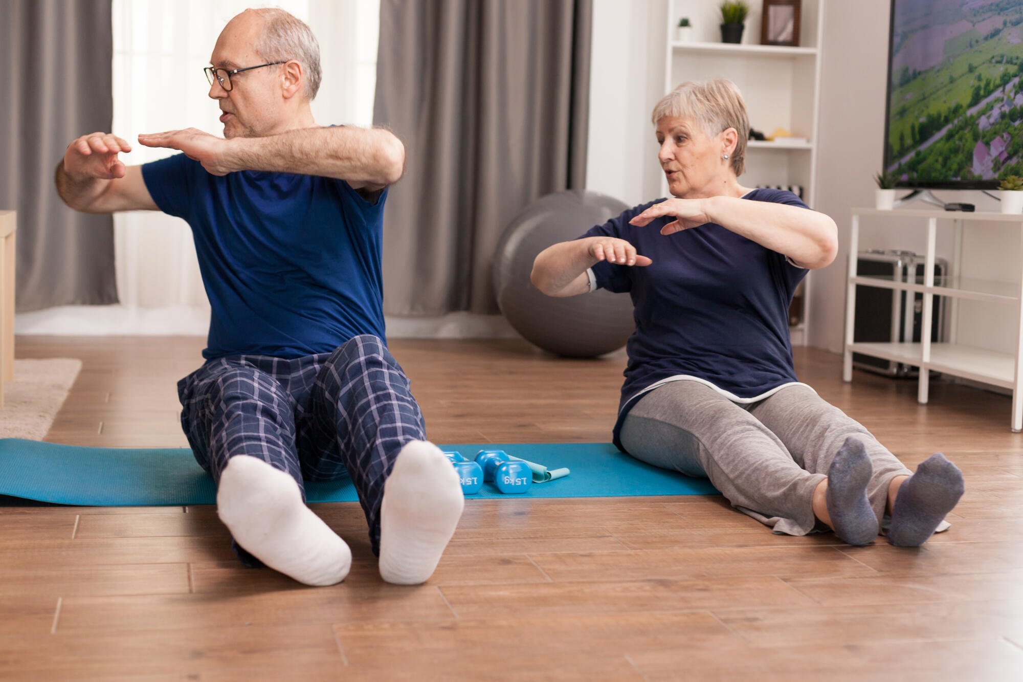 Residents participating in a fitness class indoors