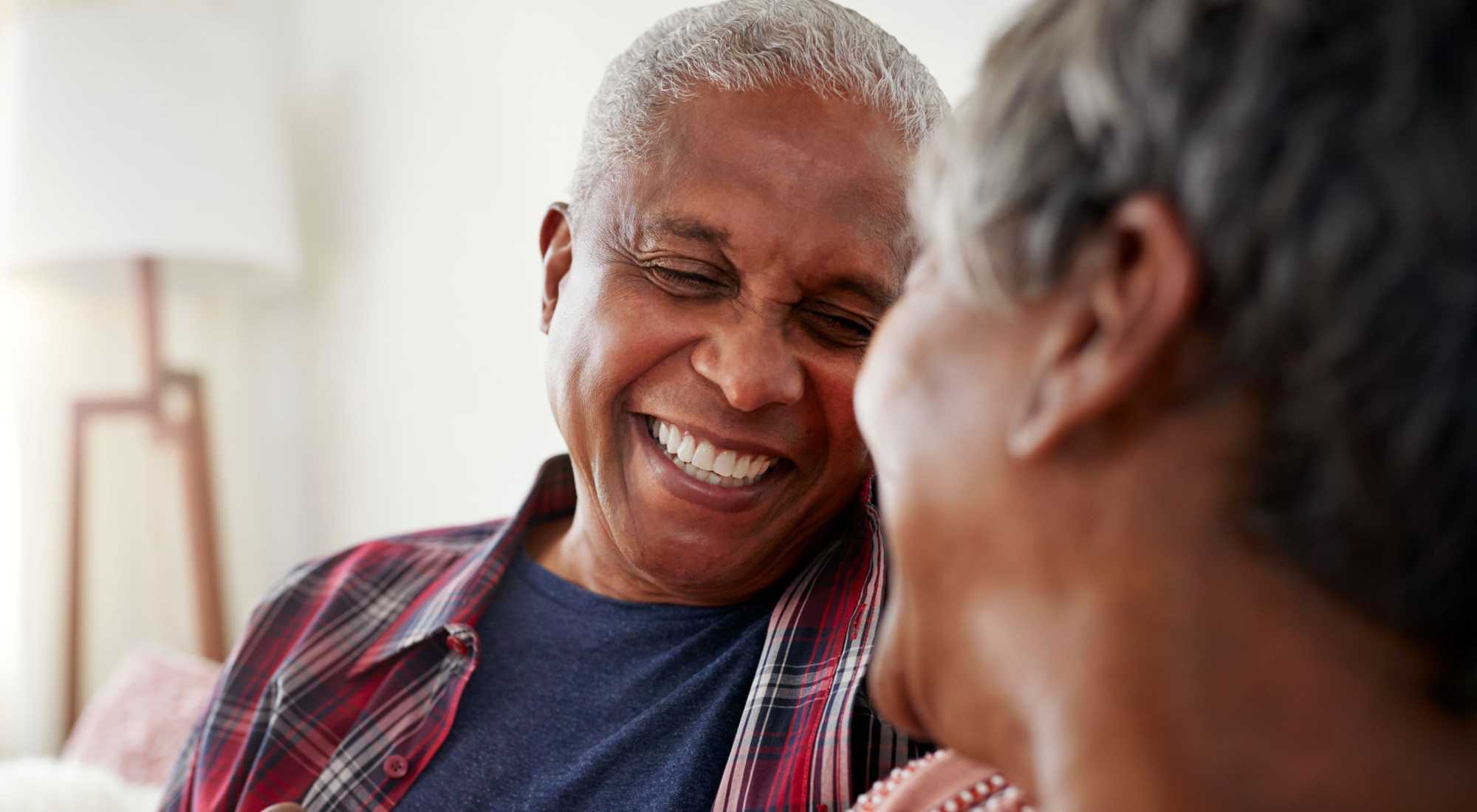 Two seniors enjoying a joyful moment together