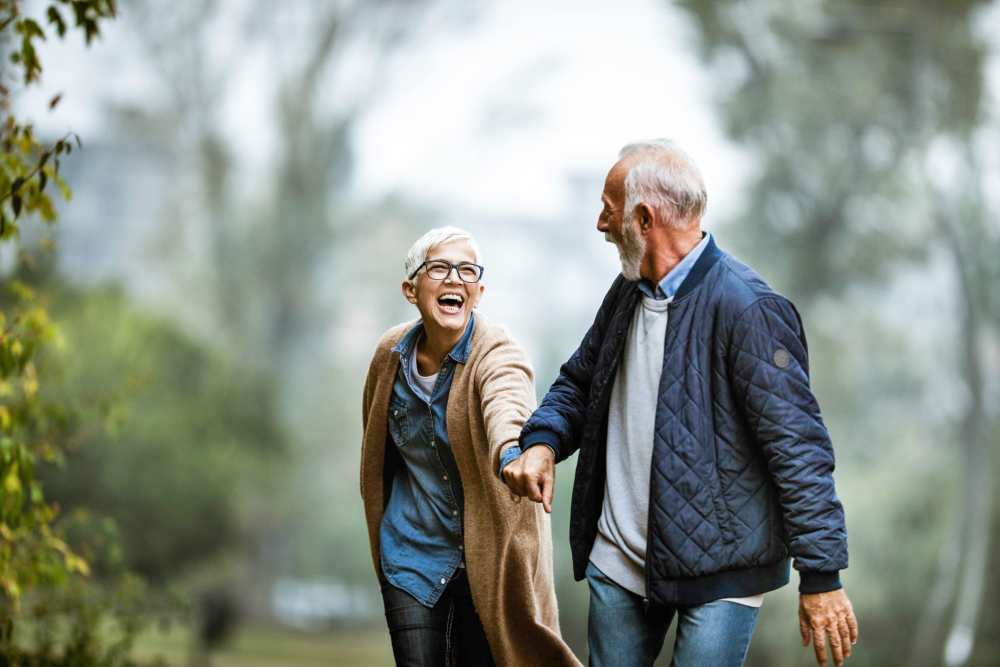Senior couple enjoying a walk in a garden