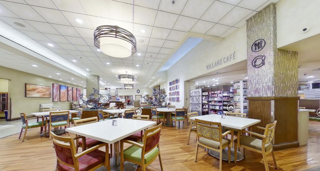Bright dining area with tables and chairs in a café setting