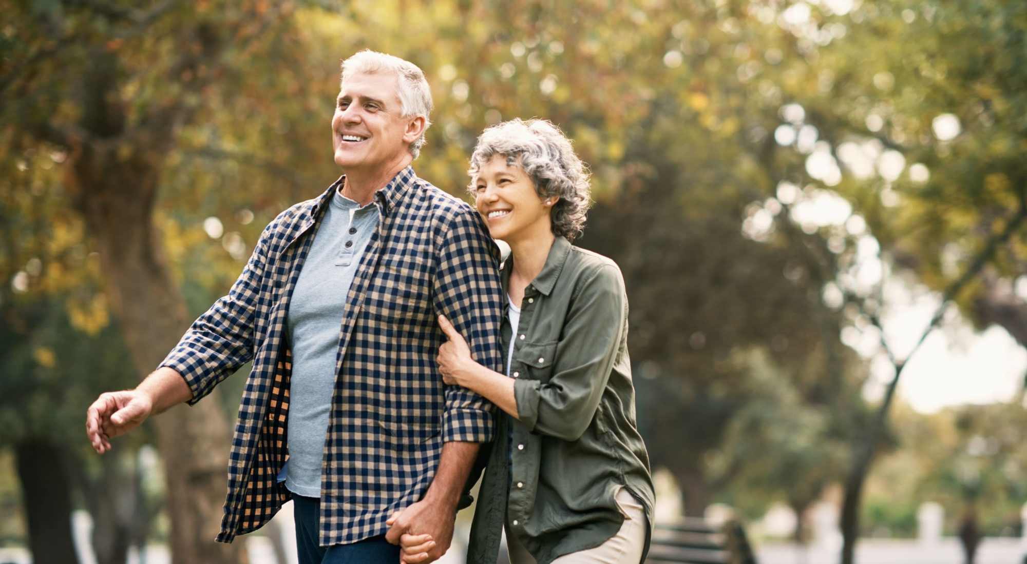 Couple enjoying a walk in a garden setting