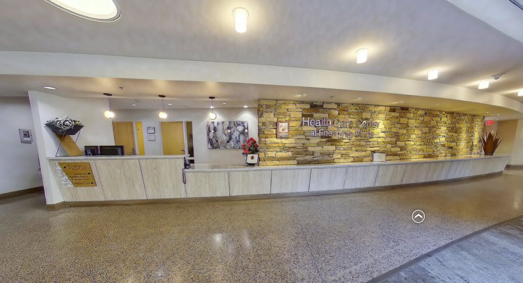 Reception area of a healthcare facility with stone wall decor