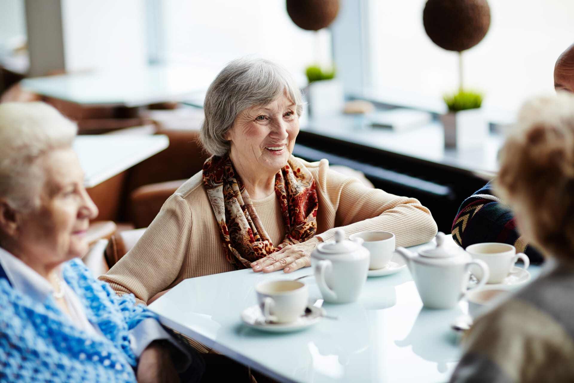Residents enjoying tea together in a dining area