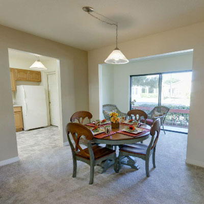 Bright dining area with a table and chairs
