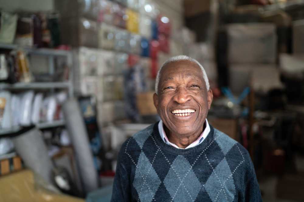 Smiling elderly man in a warm sweater