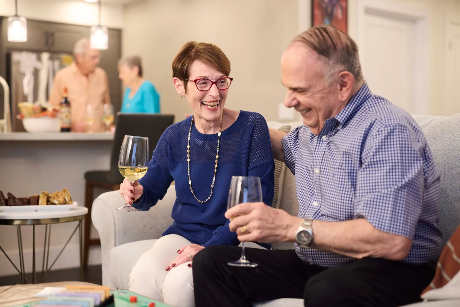Residents enjoying drinks and socializing in a common area