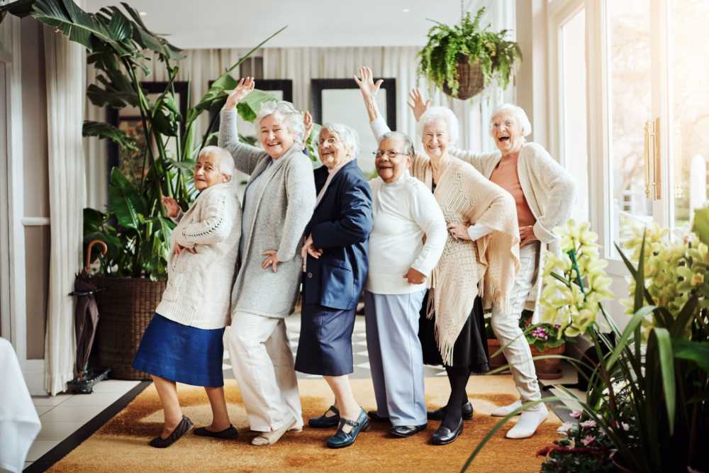 Residents joyfully posing in a common area