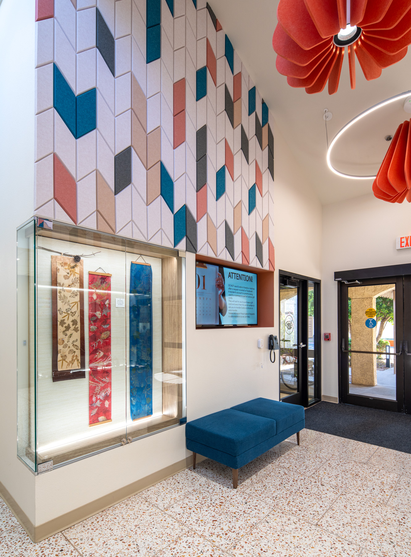 Interior view of a lobby with decorative wall and seating area