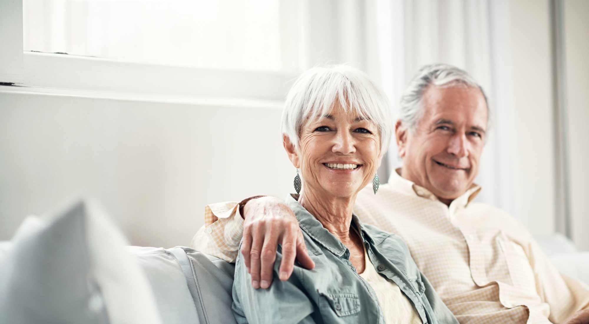 Senior couple enjoying time together in a cozy living room