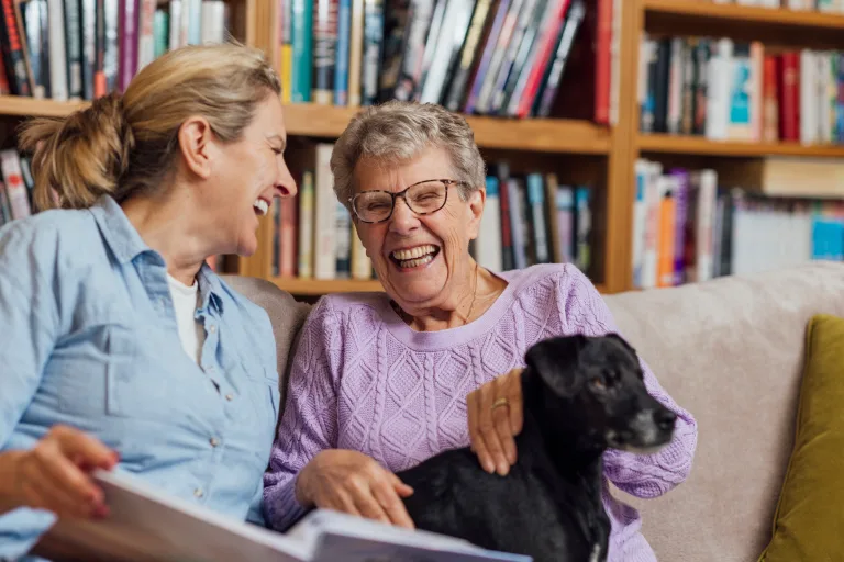 Residents enjoying time together with a dog