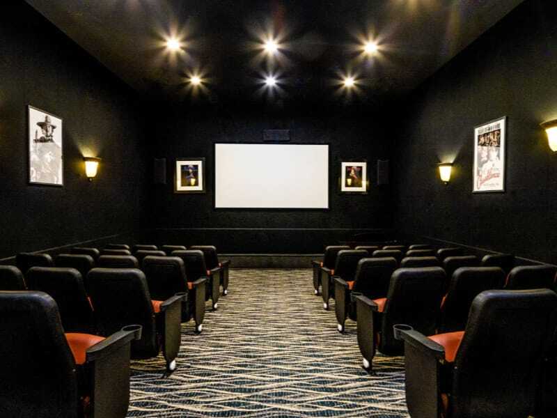 Interior view of a small theater room with seating
