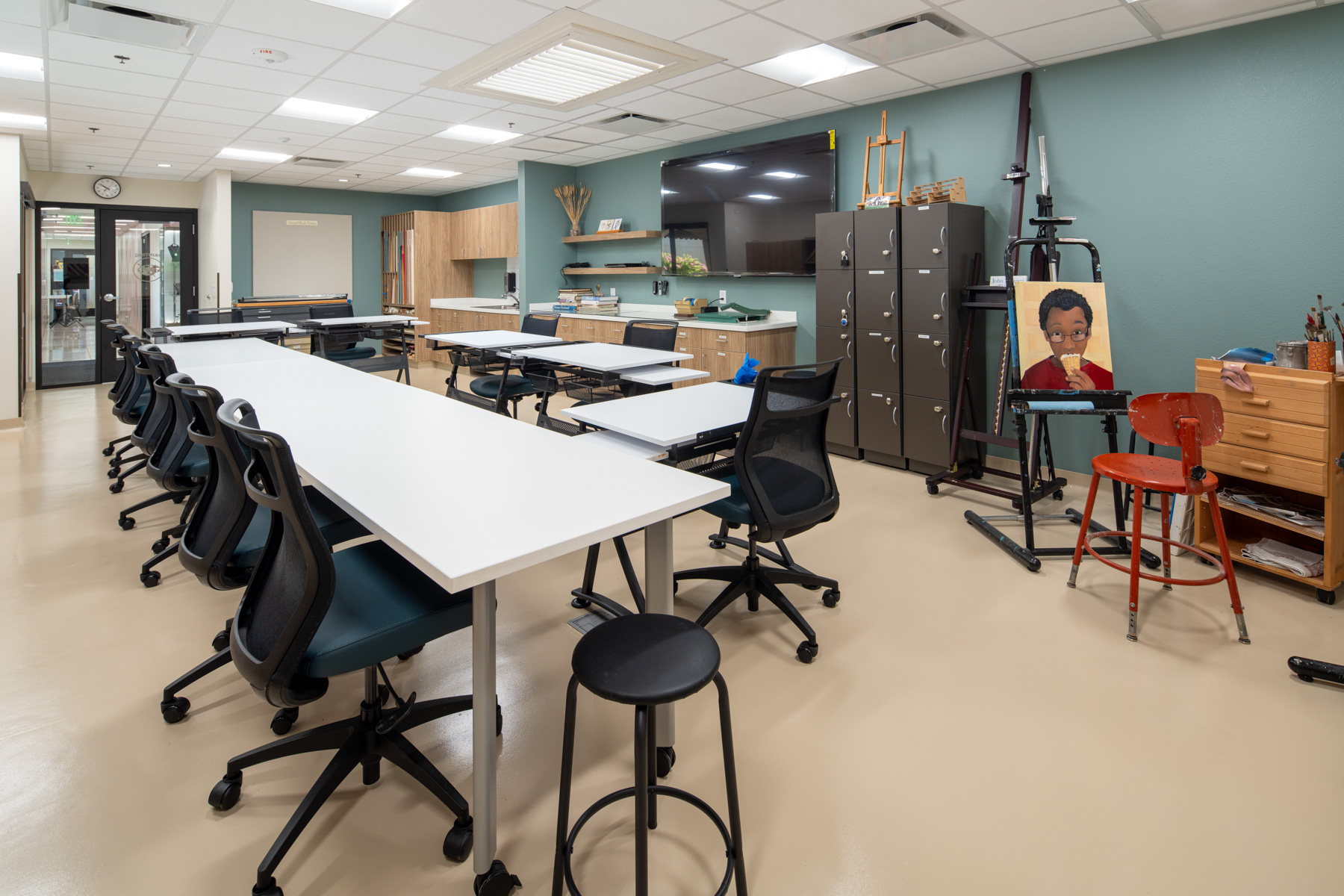 Interior view of an activity room with tables and chairs