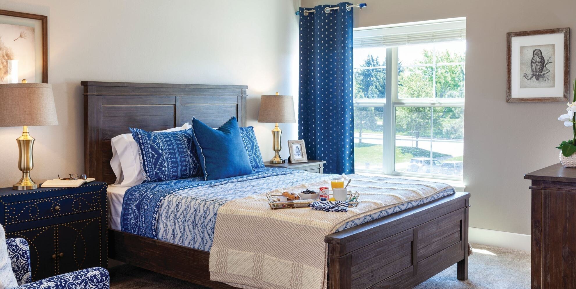 Cozy bedroom with comfortable decor and bedside amenities