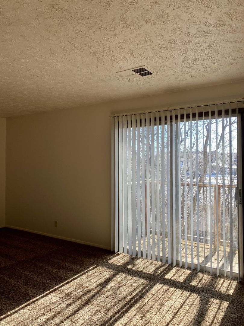 Bright interior room with sliding glass door