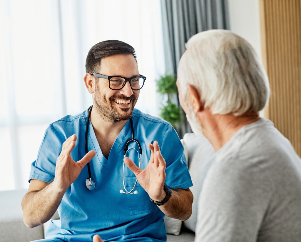 A staff member engaging with a resident in a cozy setting