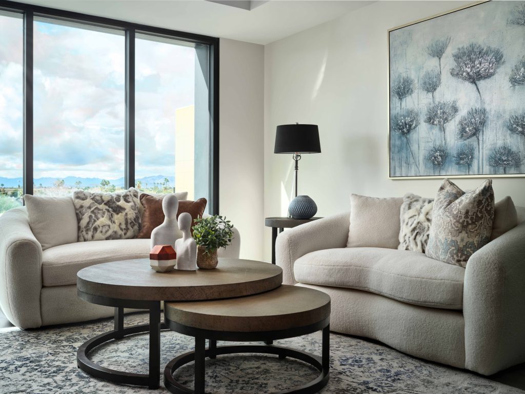 A cozy living room with modern decor and large windows