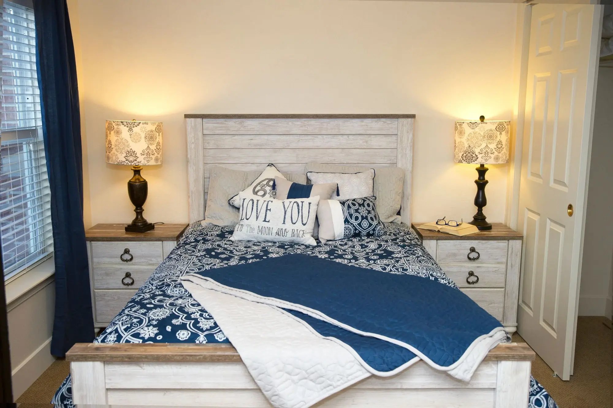 Cozy bedroom setup with blue accents and decor