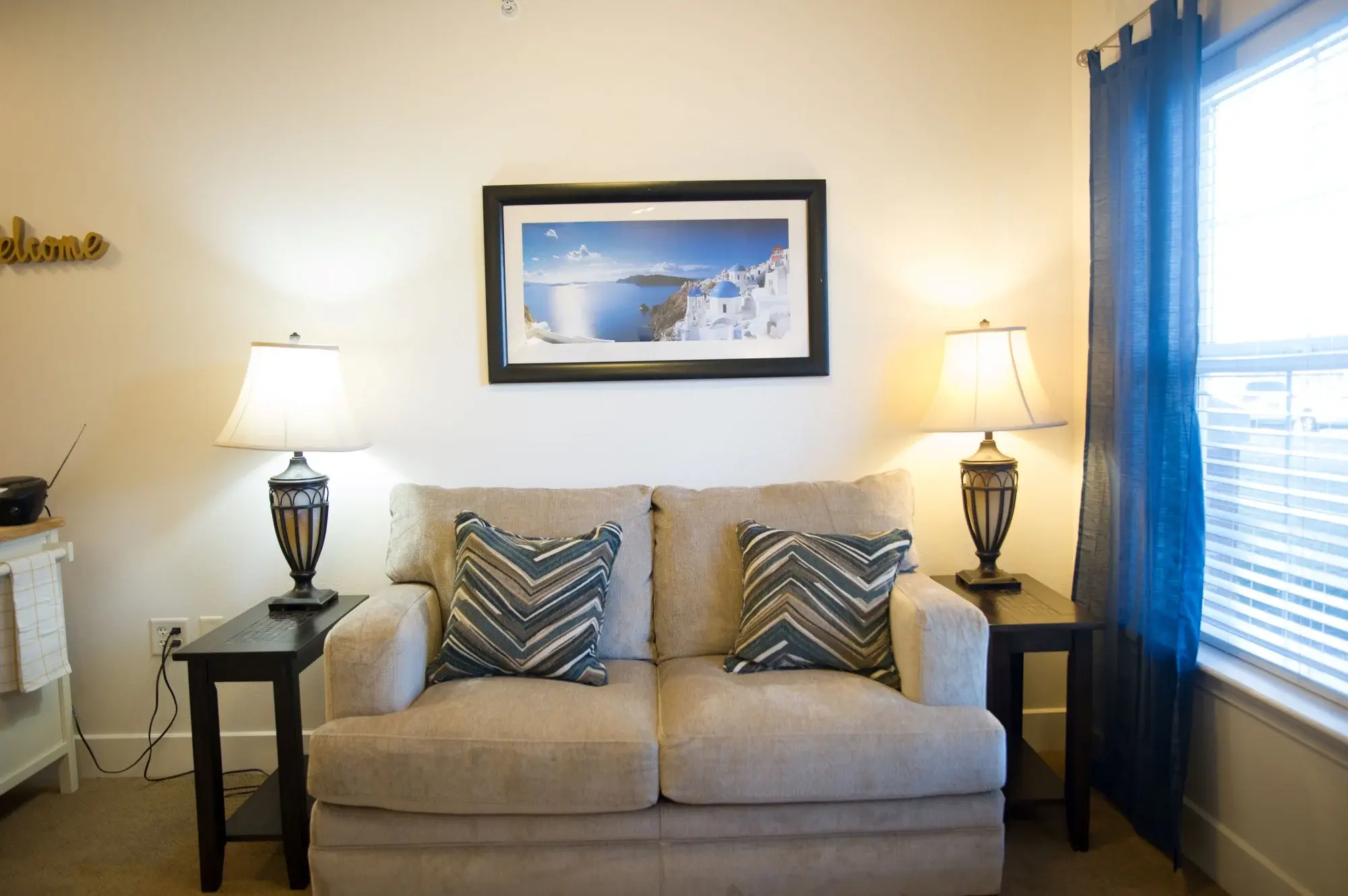 Cozy sitting area with lamps and artwork