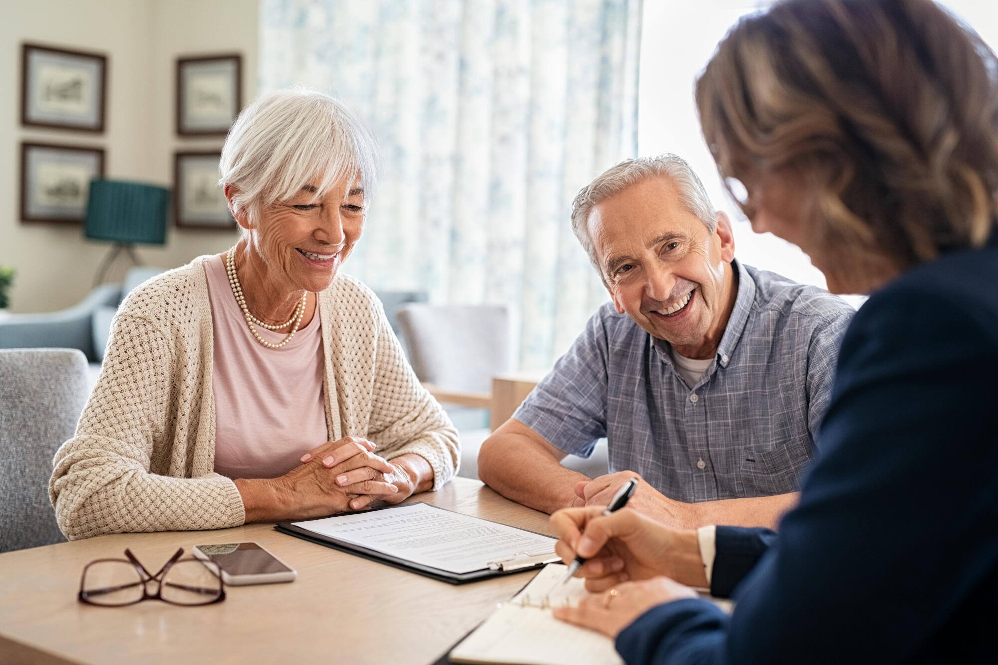 Couple engaging in conversation with a staff member