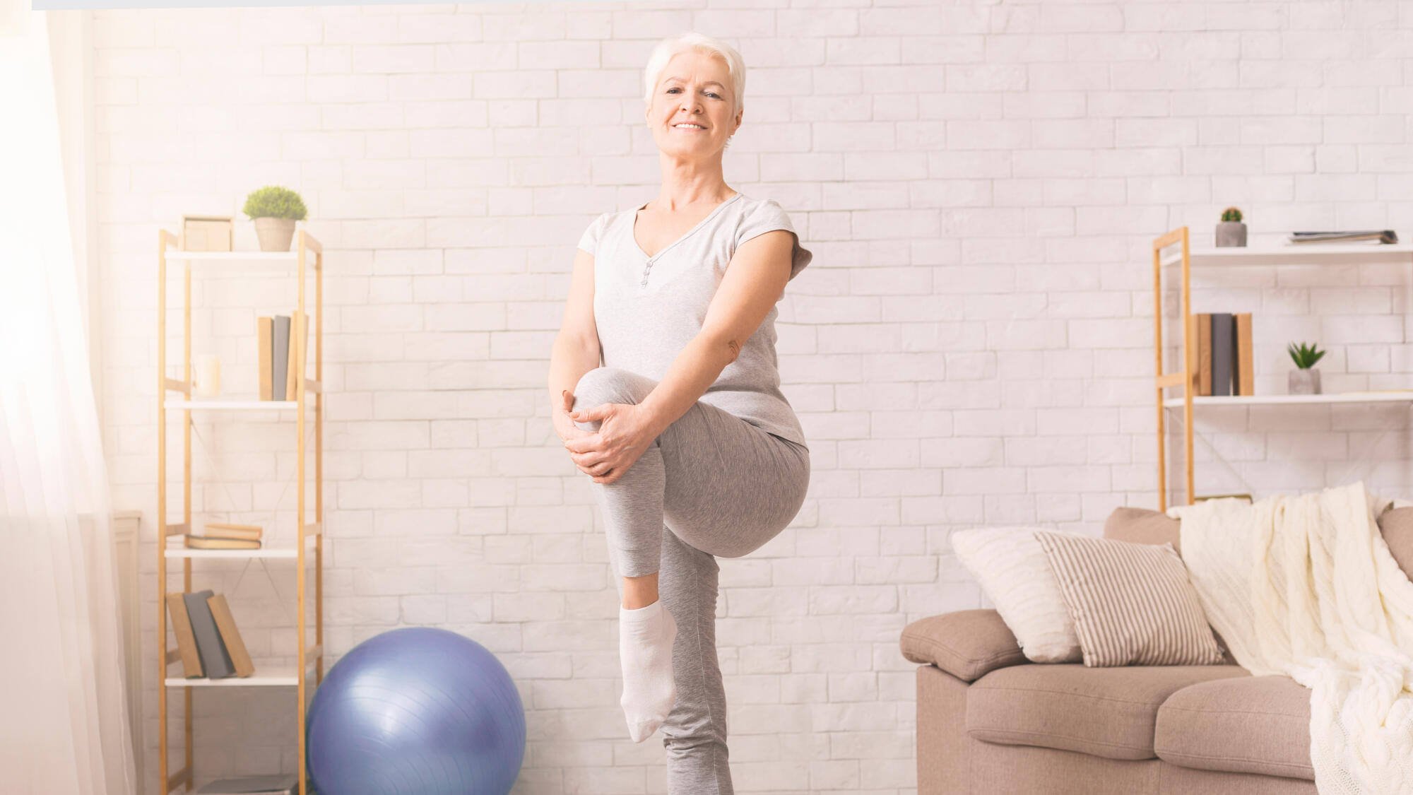 Senior woman exercising in a well-lit activity room