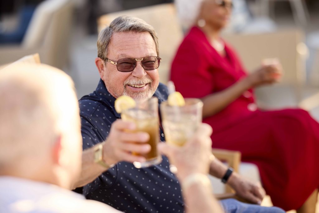 Residents enjoying drinks together outdoors