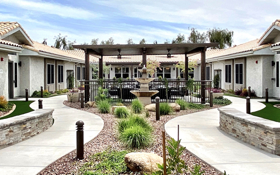 Outdoor courtyard with seating and landscaping.