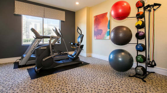Well-equipped fitness area in senior living facility.