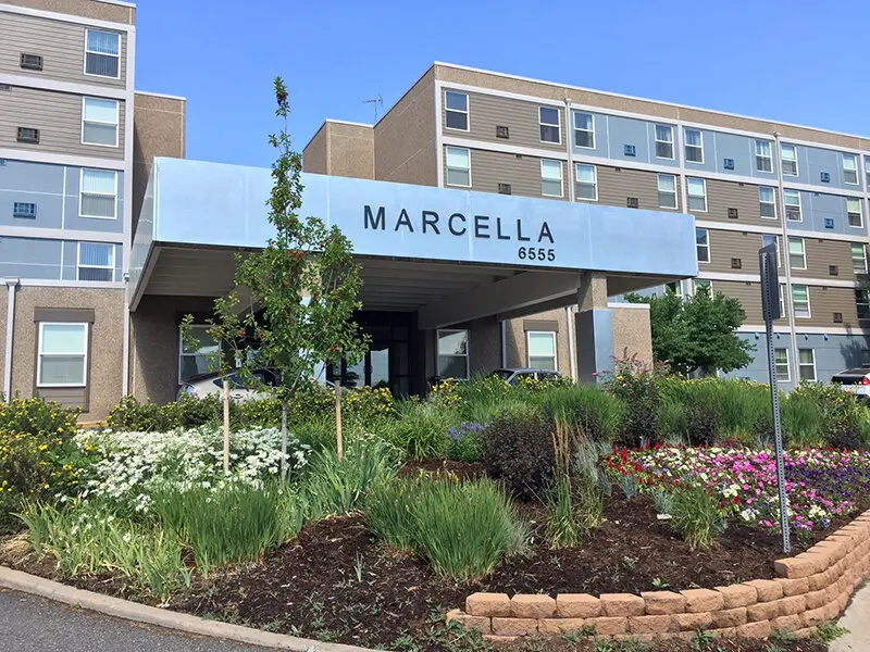 Front entrance of Marcella Manor Apartments with landscaping